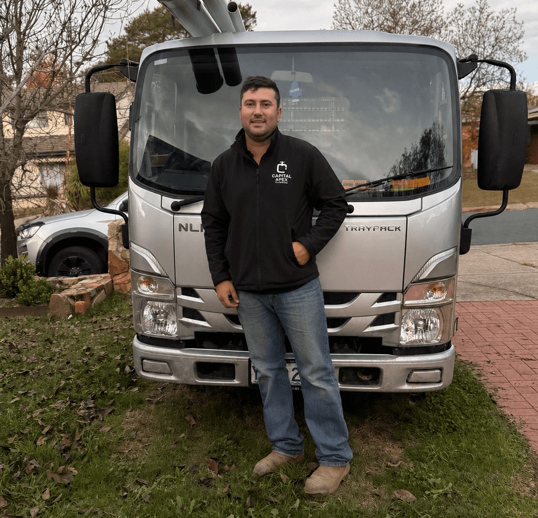 Connor from Capital Apex Plumbing with his truck